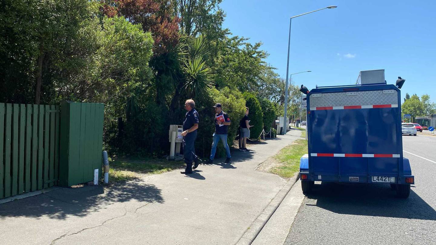 Police at the Papanui property after the body was found. Photo: Anna Leask / NZH