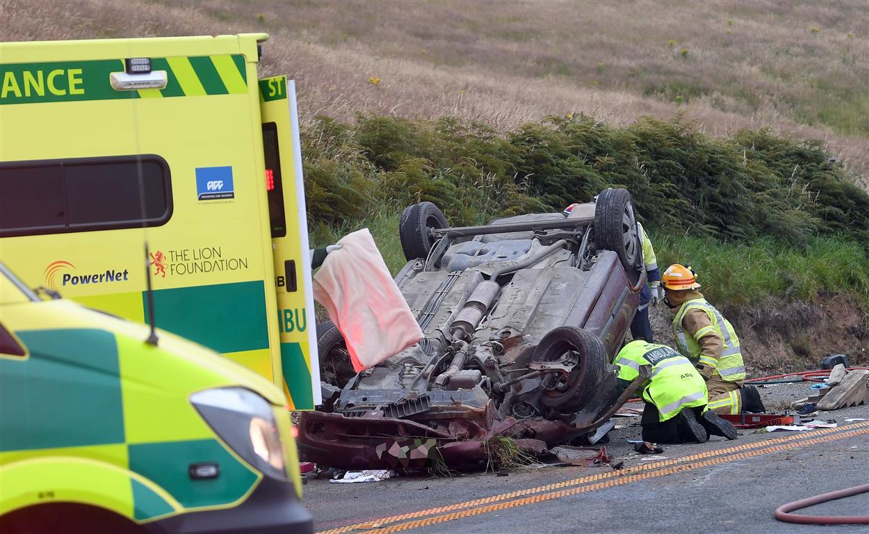 Emergency services at the crash scene this morning. Photo: Stephen Jaquiery