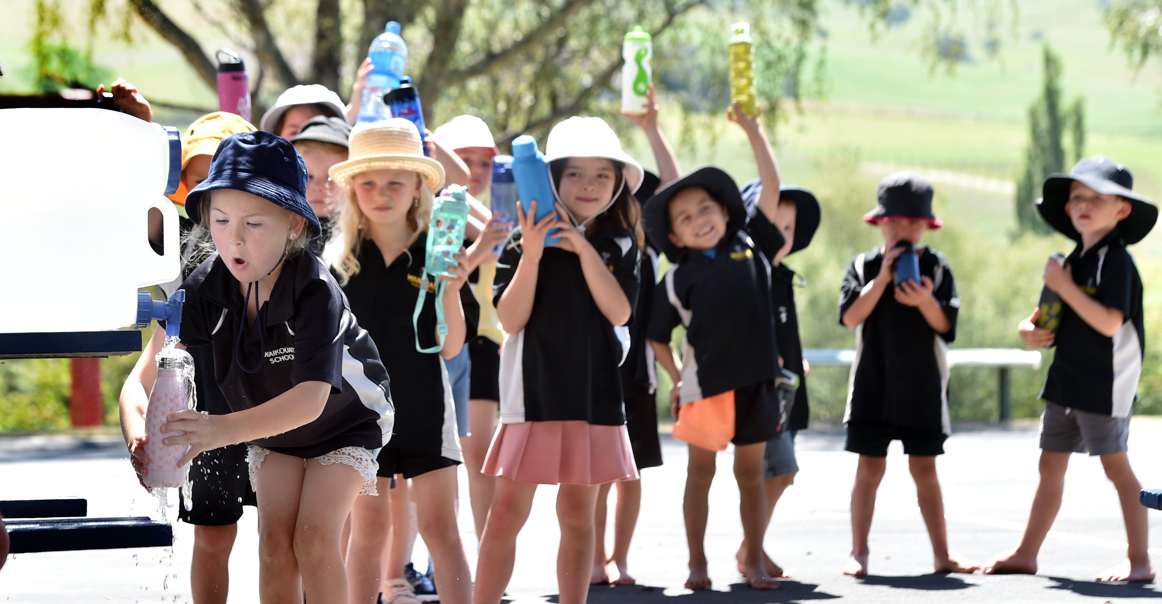 Waikouaiti School pupil Bonnie Goodman (6) fills up her drink bottle with water provided by the...