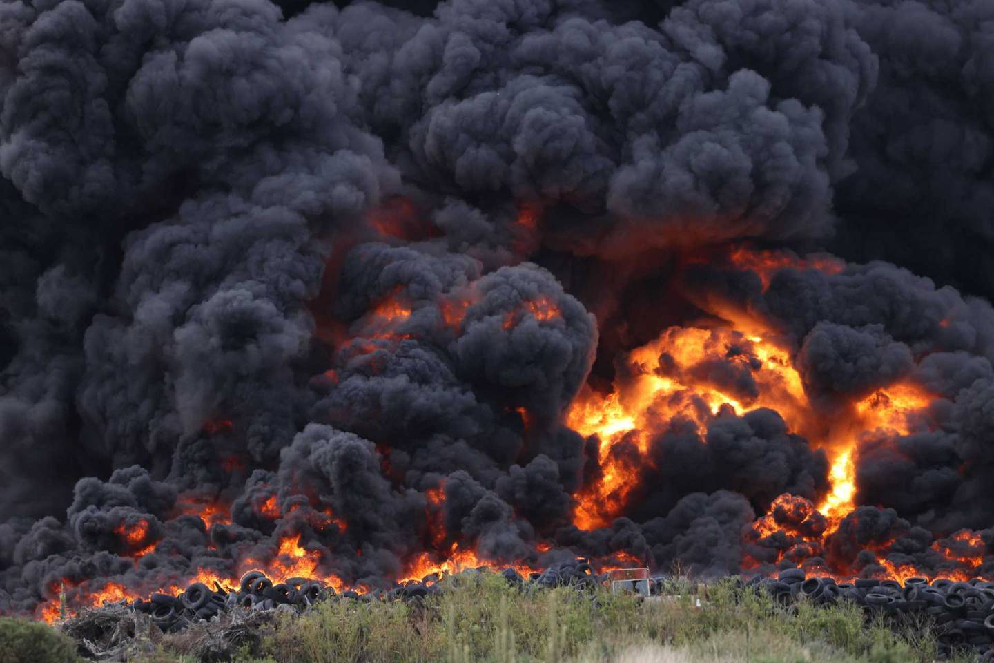 Smoke billows into the air from the tyre fire. Photo: George Heard / NZH