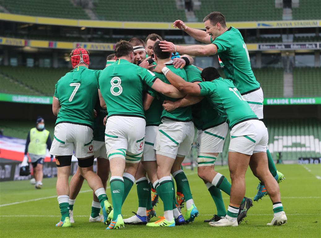 Ireland players celebrate their first try against England. Photo: Reuters