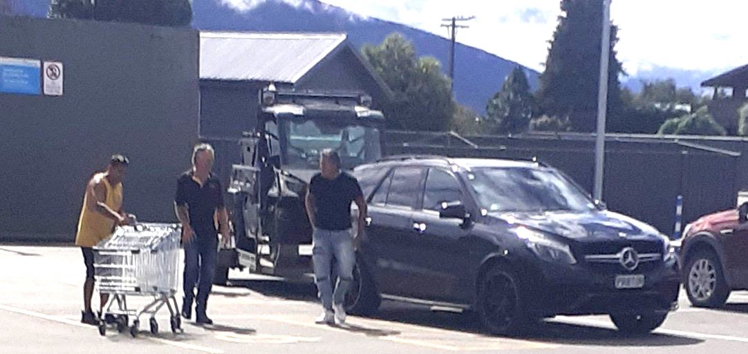 Destiny Church leader Brian Tamaki (right) in a supermarket car park in Te Anau on Tuesday. PHOTO...