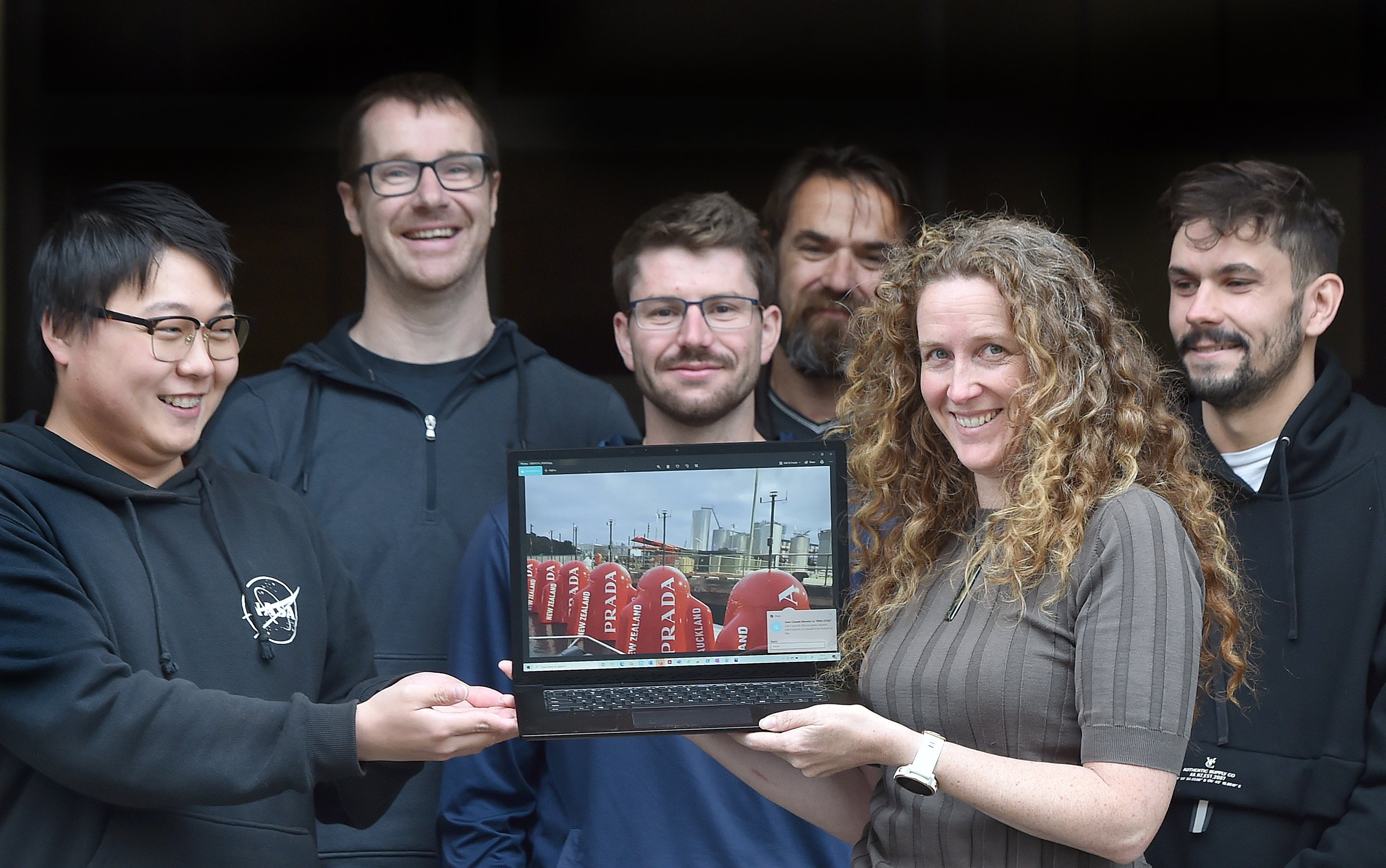 Igtimi general manager Kylie Robinson holds an image of America’s Cup race markers featuring...