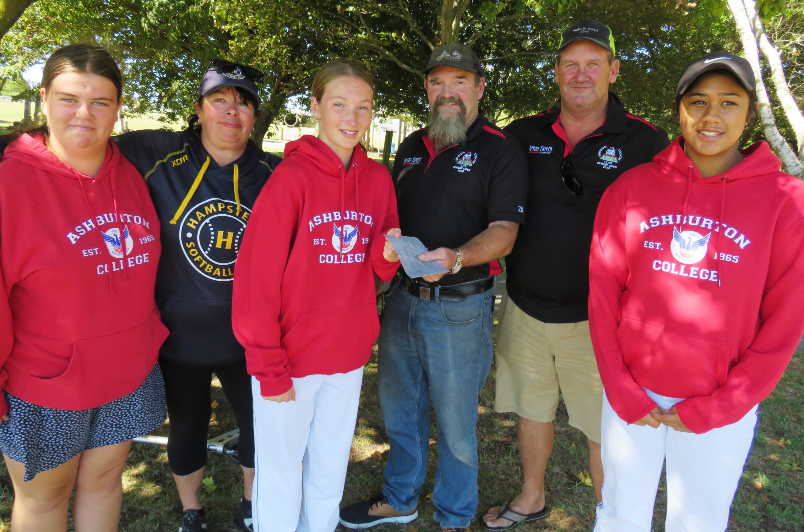 Ashburton College girls softball team members (from left) Briar Clark, team coach Lyndall...