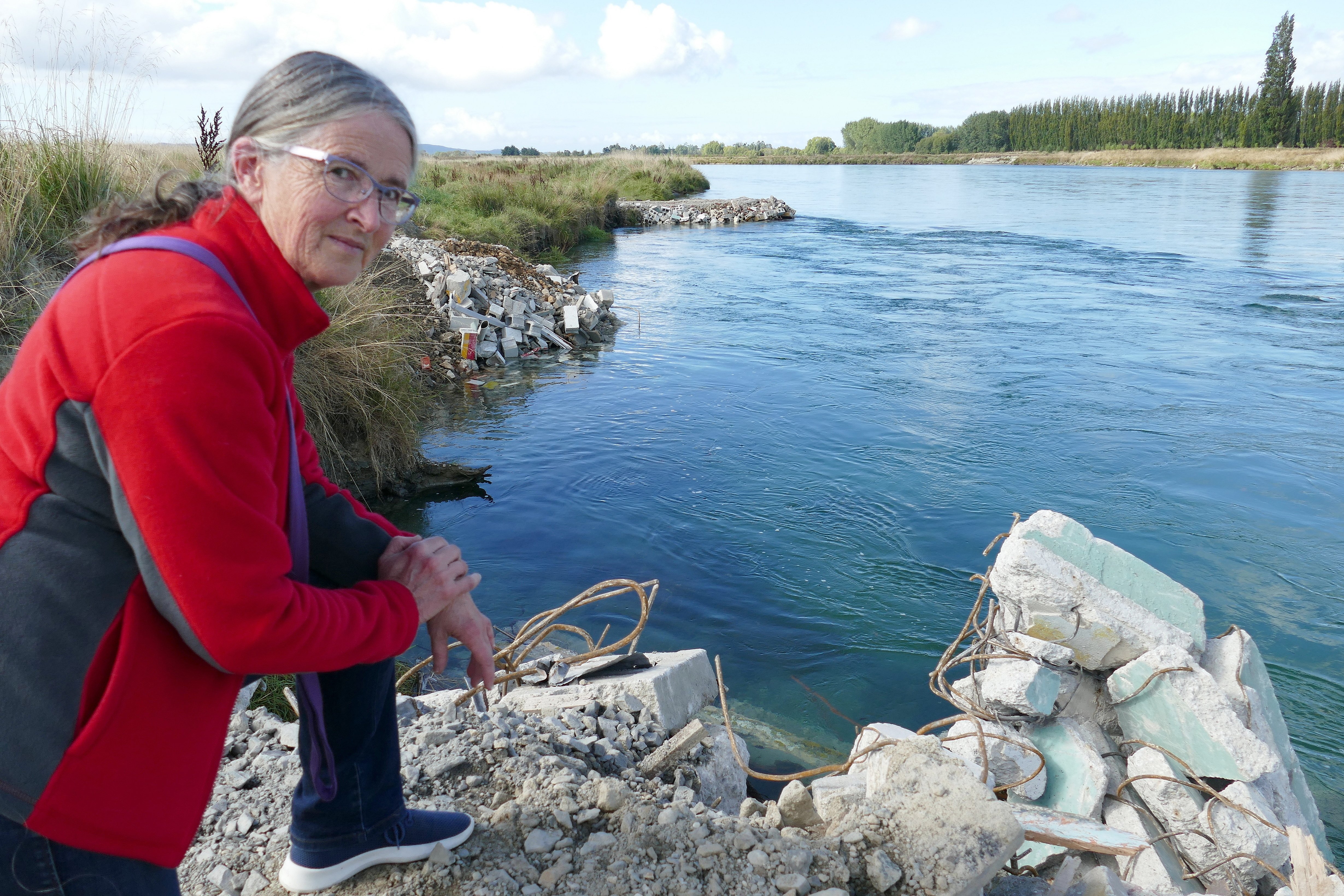 Concerned Balclutha resident Suzanne Schofield inspects demolition rubble she says was dumped in...