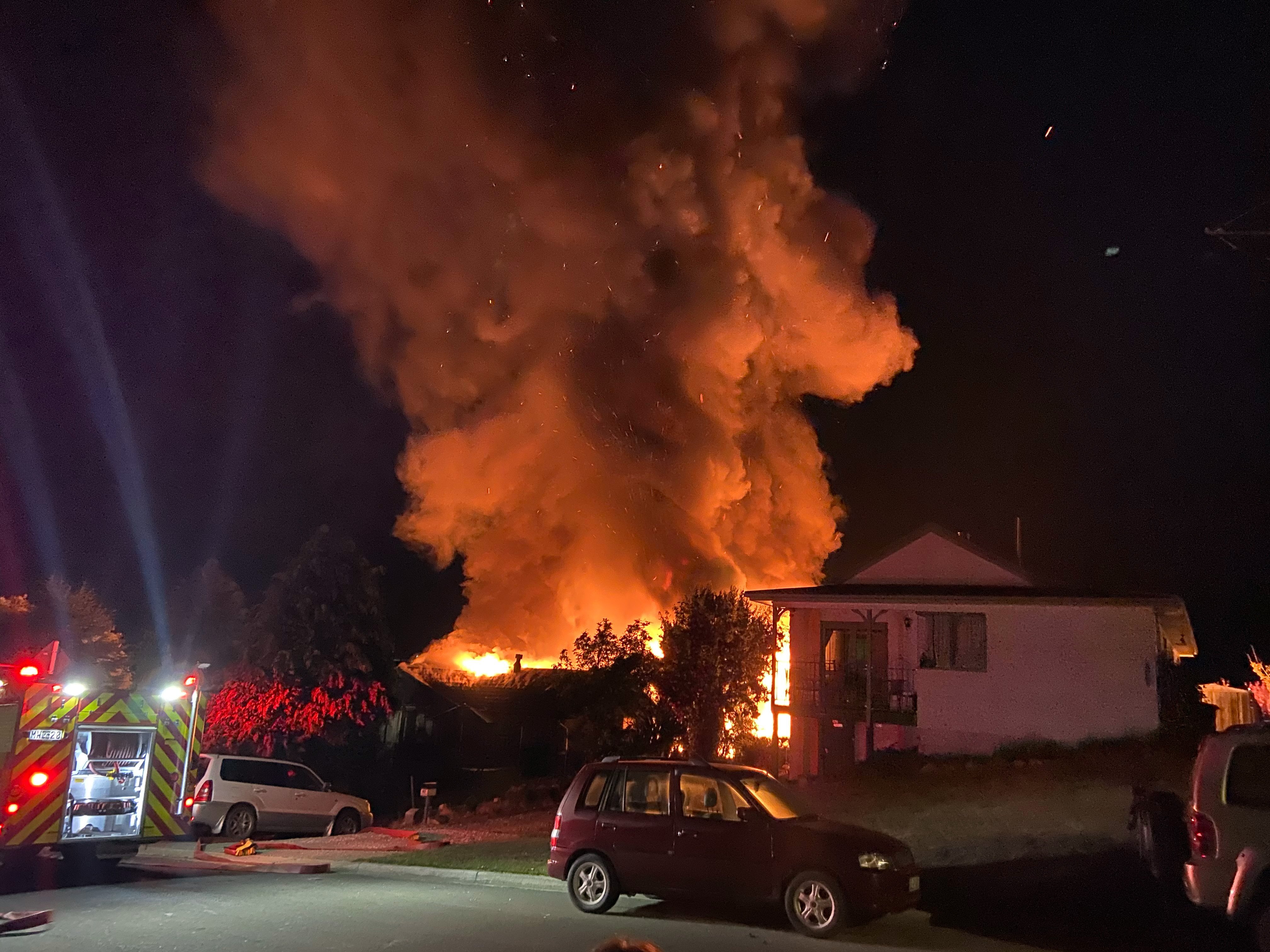 A house burns in Totara Tce, Wanaka, yesterday morning. Photo: Chris Adam.