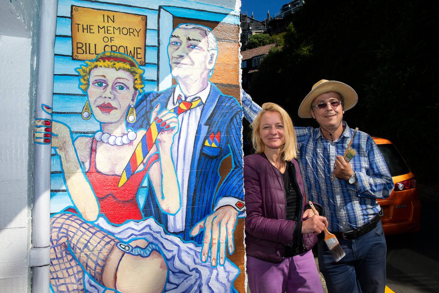 Artists Anna Proc and Gabriel Heimler (aka Heimler and Proc) alongside their mural. Photo: NZ Herald