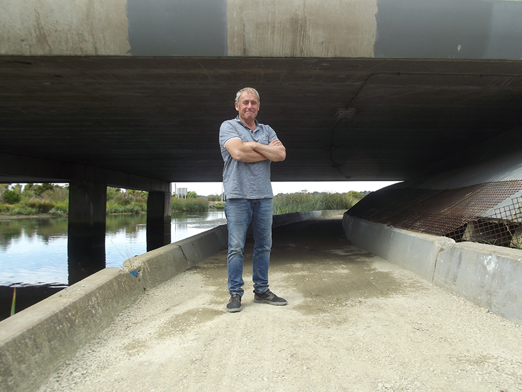 City councillor Phil Mauger wants to repair the flood-prone footpath beneath the Anzac bridge....