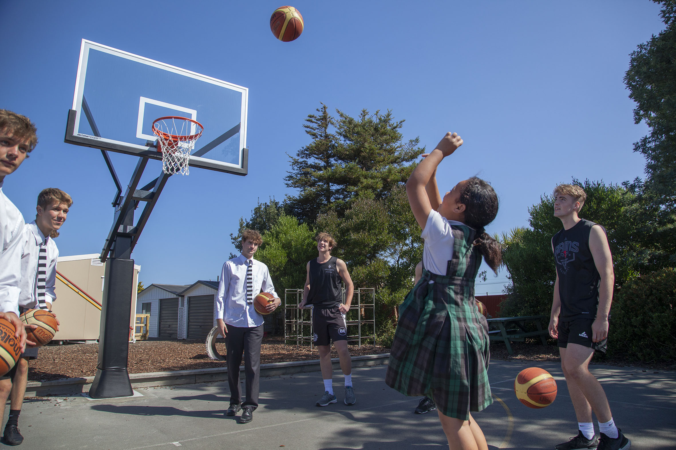 Christ's College senior A basketball players use the new basketball hoops with St James School...