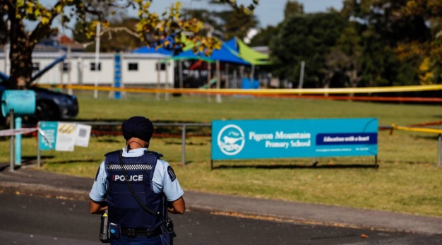 Police at Pigeon Mountain School last Tuesday after the girl was struck by a car. Photo: NZ Herald