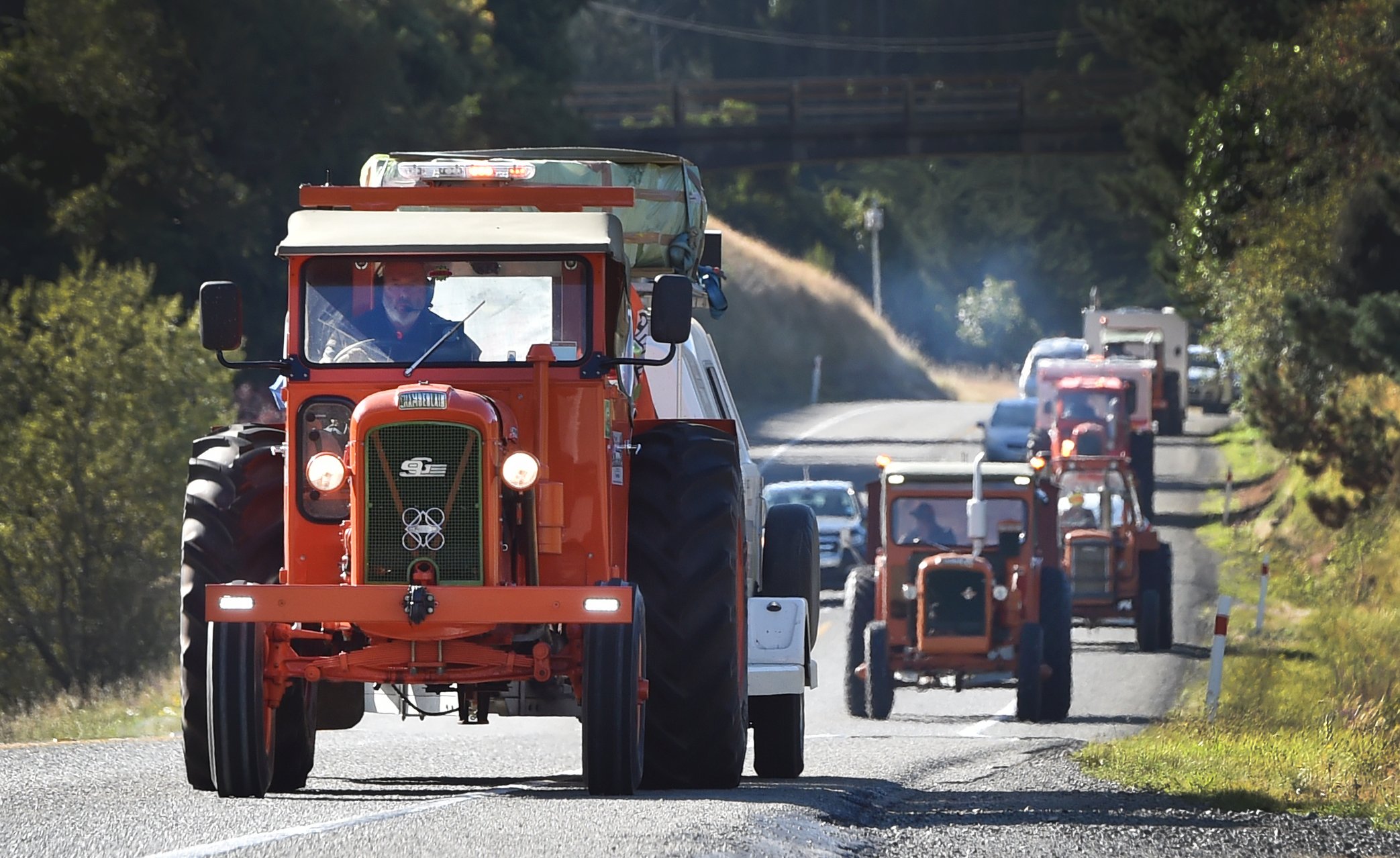 Steve Day leads the way for the Heartland Tractor Trek on the Dunedin Northern Motorway yesterday...