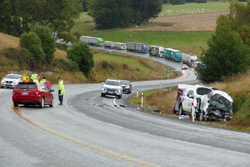 Police review the scene of the crash on State Highway 1. PHOTO: RICHARD DAVISON