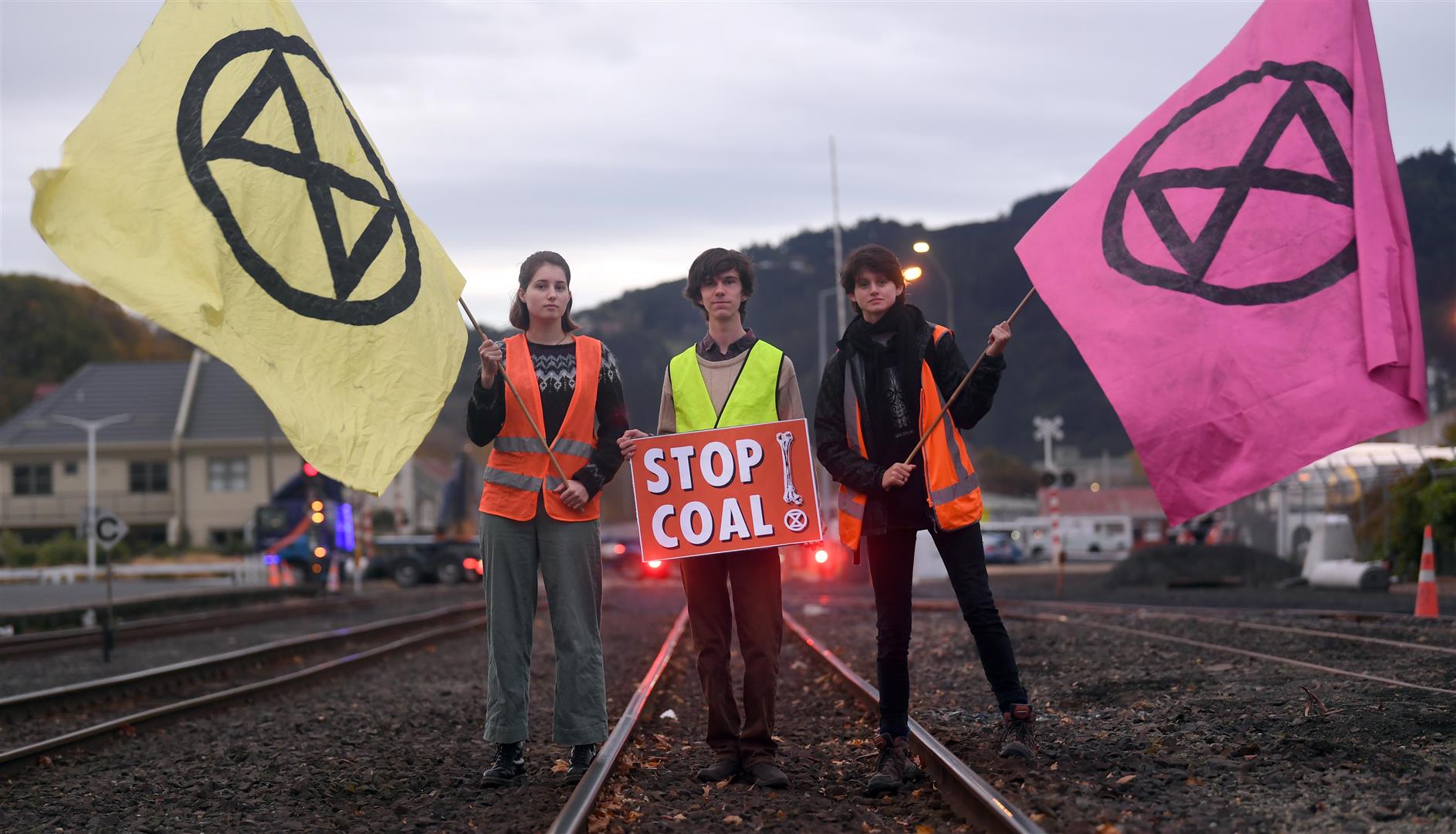 Protesters opposing the use and transport of coal block the railway tracks near the Dunedin Railway Station this morning. Photo: Stephen Jaquiery