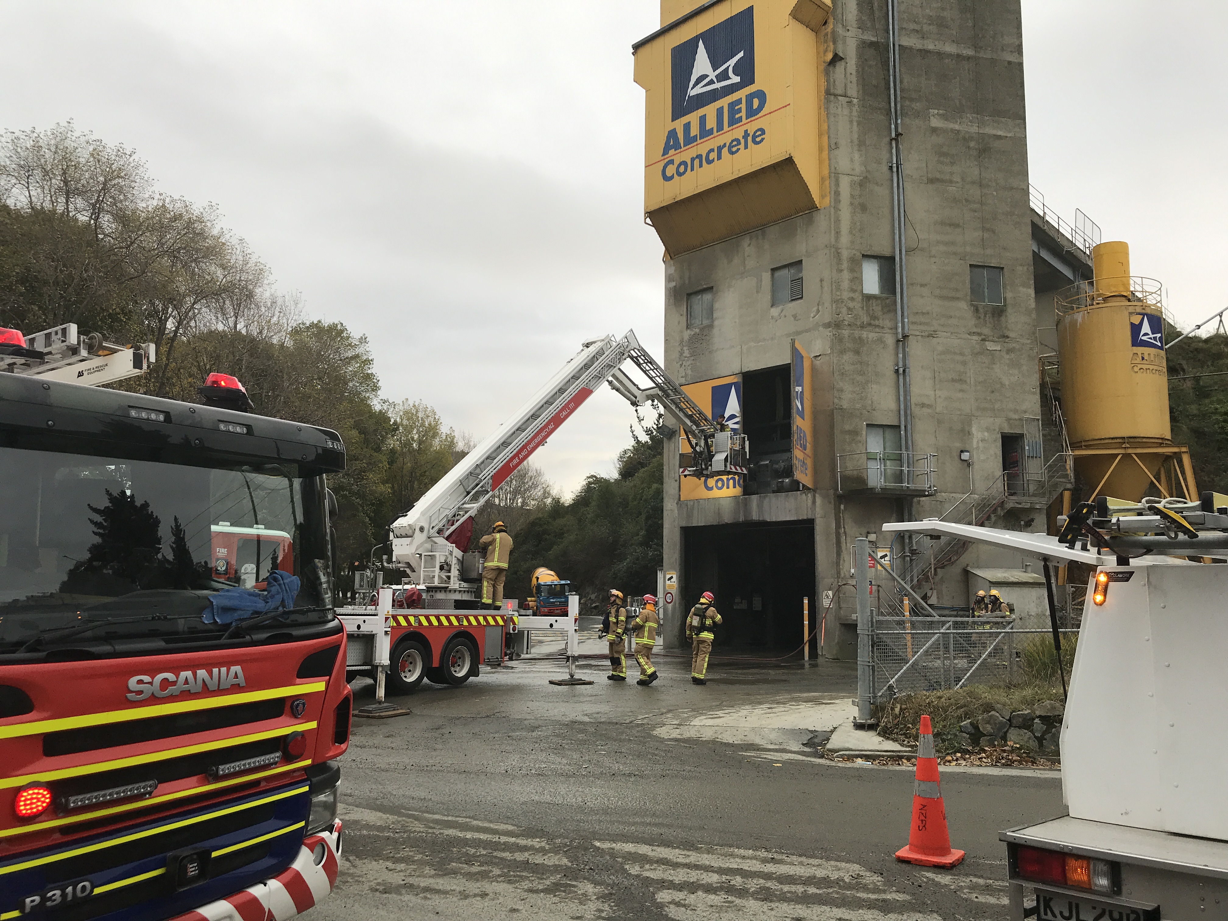 Fire crews attend to a fire in the mixing room at Allied Concrete this morning. Photo: Gregor Richardson Fire crews attend to a fire in the mixing room at Allied Concrete this morning. Photo: Gregor Richardson