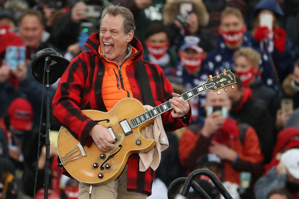 Ted Nugent performs The Star Spangled Banner during a campaign rally for Donald Trump in Lansing,...