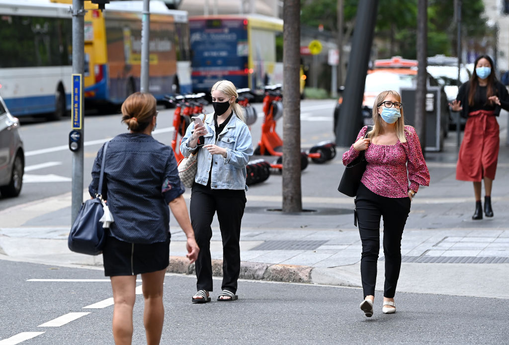 People walk through the Brisbane CBD during the three-day lockdown which ends today. Photo: Getty