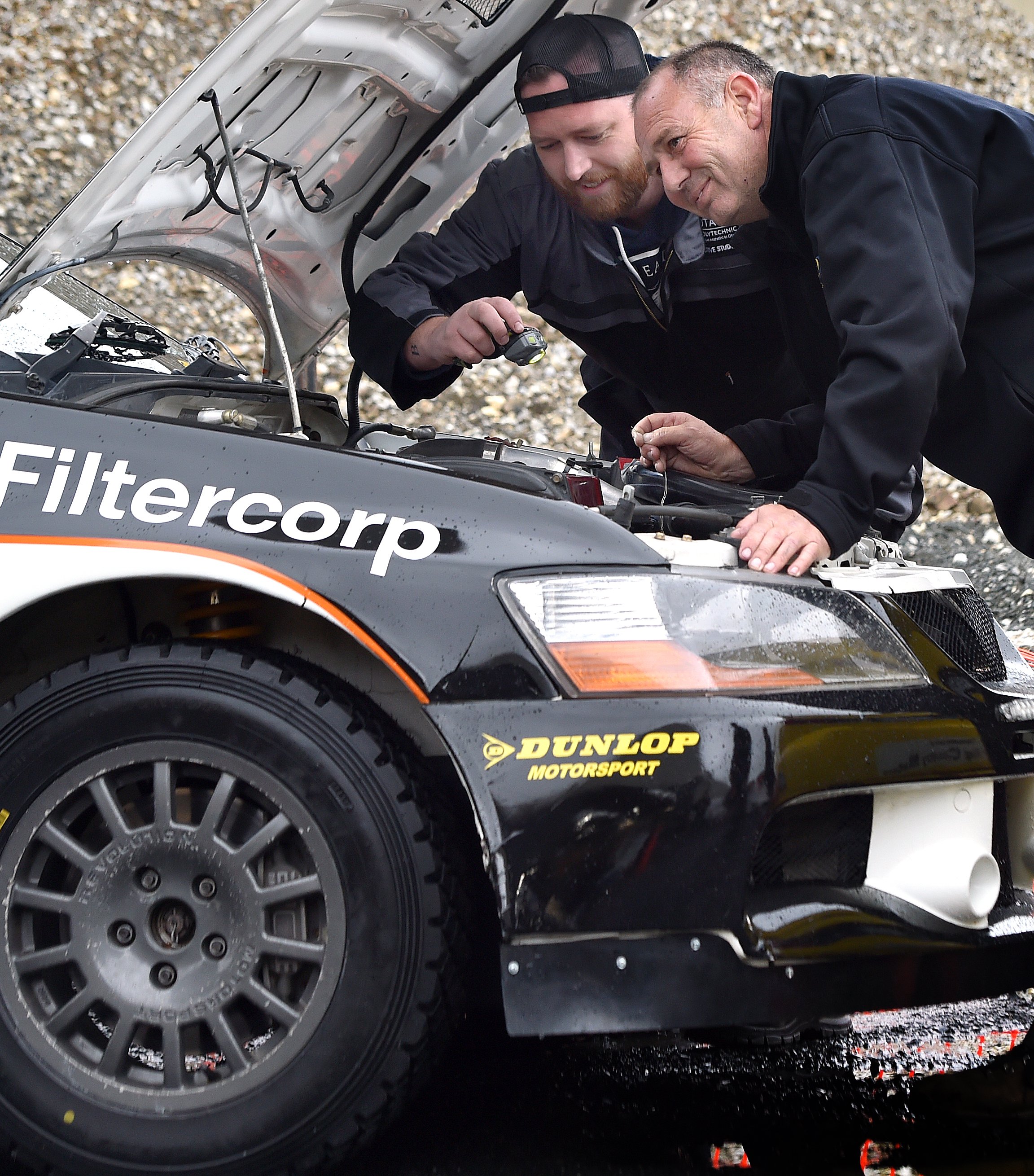 Otago Polytechnic automotive engineering student Rick McGuirk watches as New Zealand Rally...