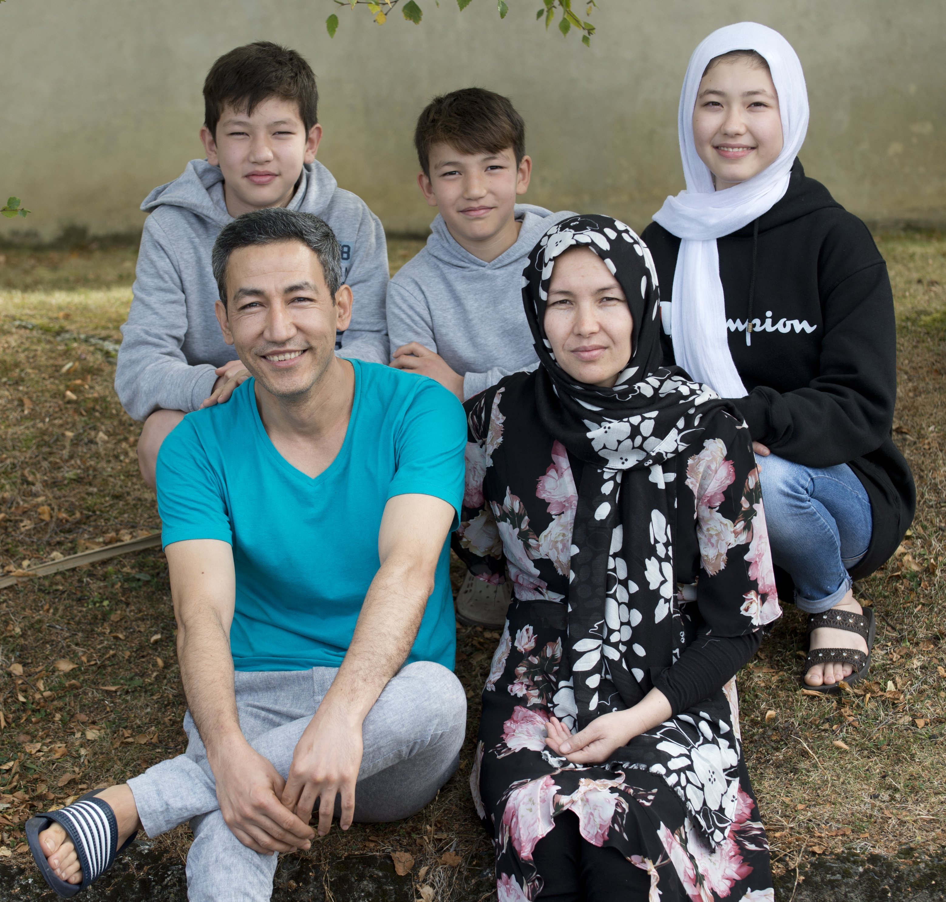 The Ahmadi family, (back, from left) Ali Sina (12), Amir Ali (10), Sumaya (13), (front, from left...