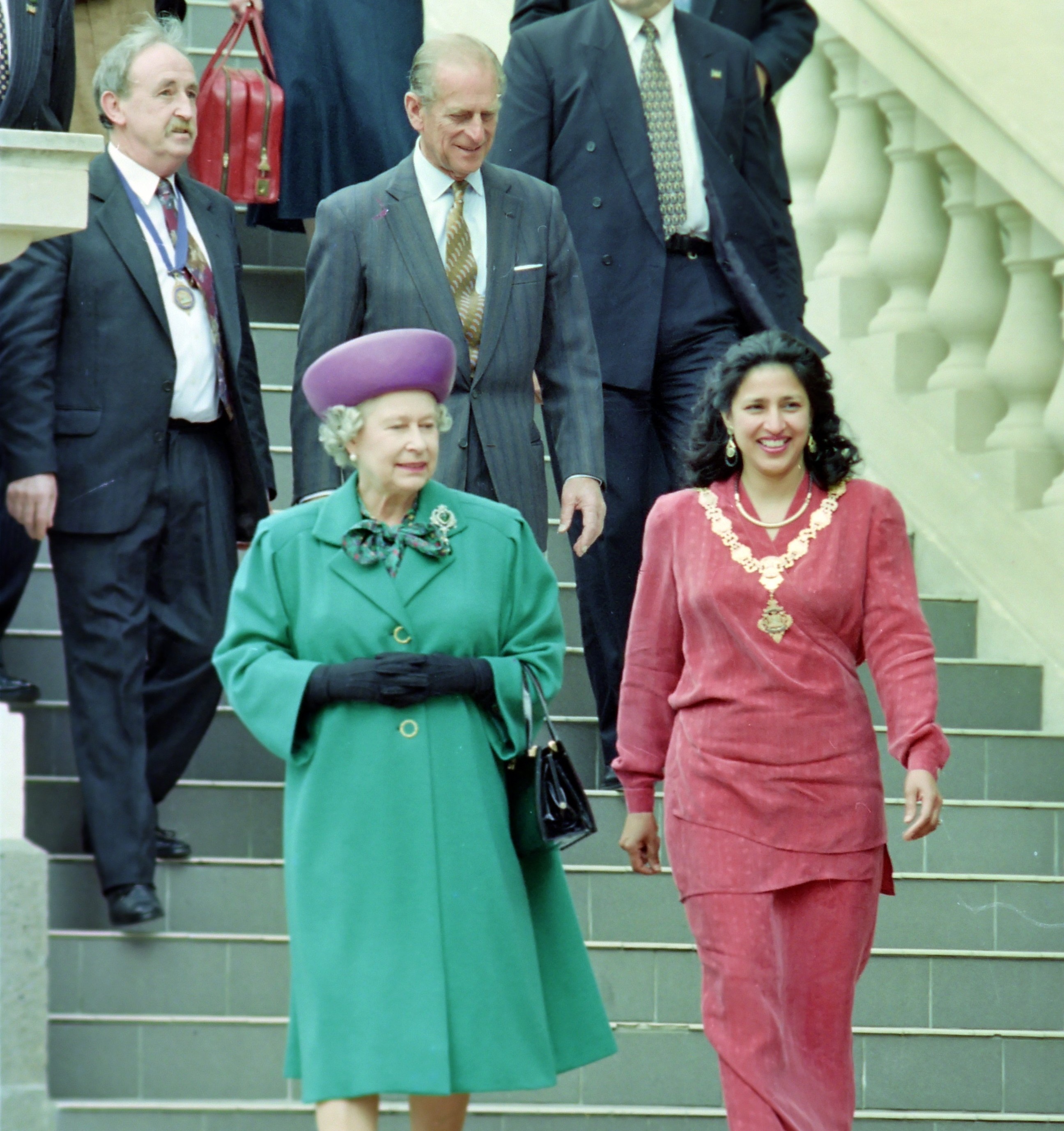 Dunedin mayor Sukhi Turner and the Queen walk down the Municipal Chambers steps in Dunedin in...