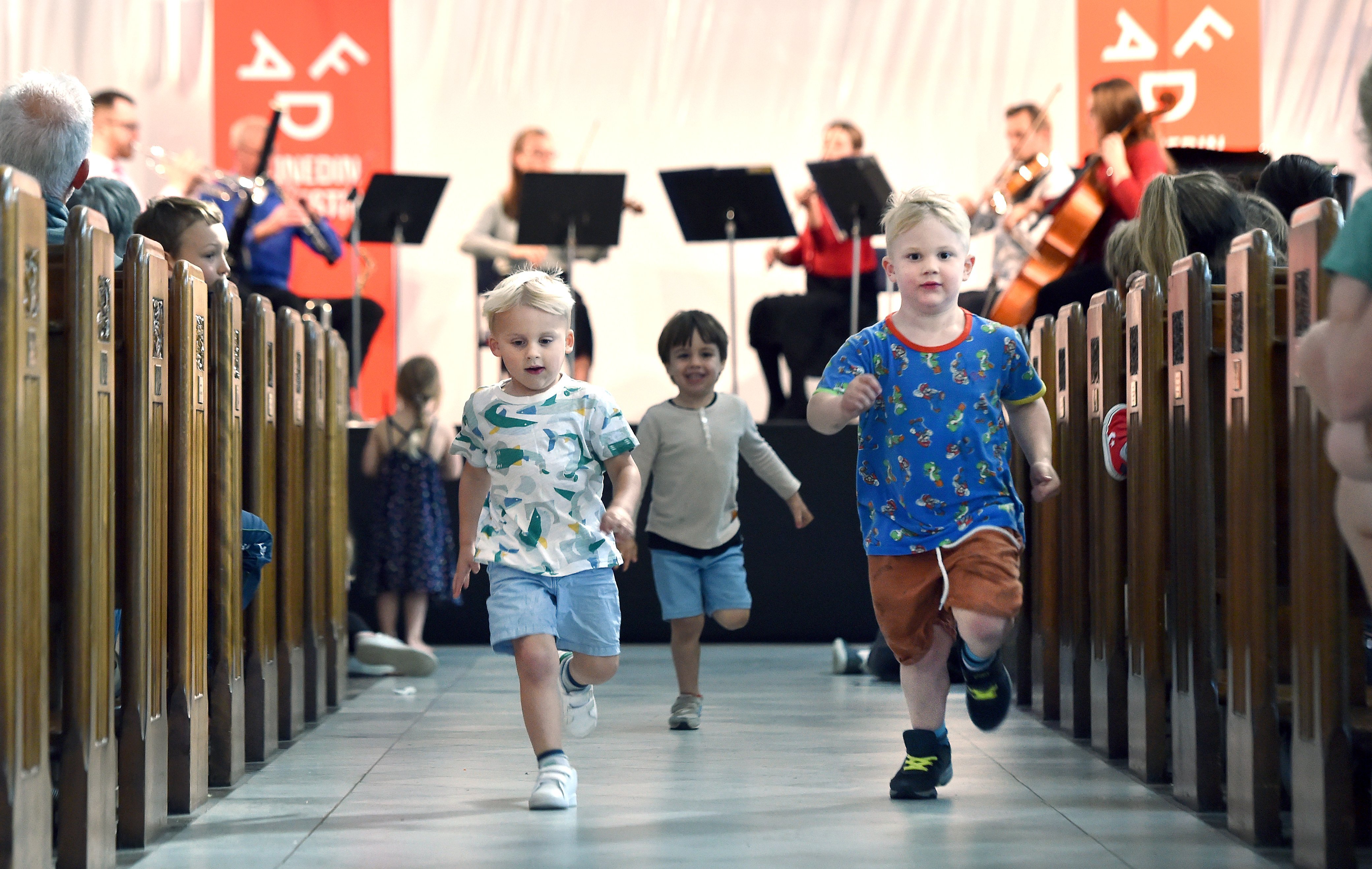 Big fans of Beethoven and running around churches (from left) Jimmy Burke (3), Oscar Muir (3) and Matteo Guidi (4) all of Dunedin, run down the central aisle at at St Paul’s Cathedral. PHOTO: PETER MCINTOSH