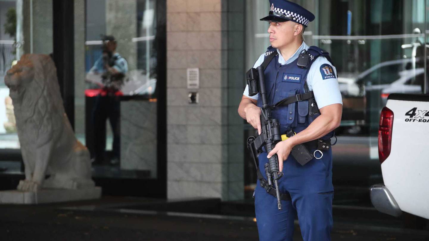 Armed police stand guard outside the Sofitel Hotel on Auckland's Viaduct this morning. Photo: NZ...