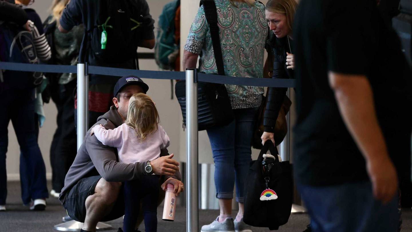 Travellers waiting to board flights to Australia from Christchurch. Photo: George Heard 