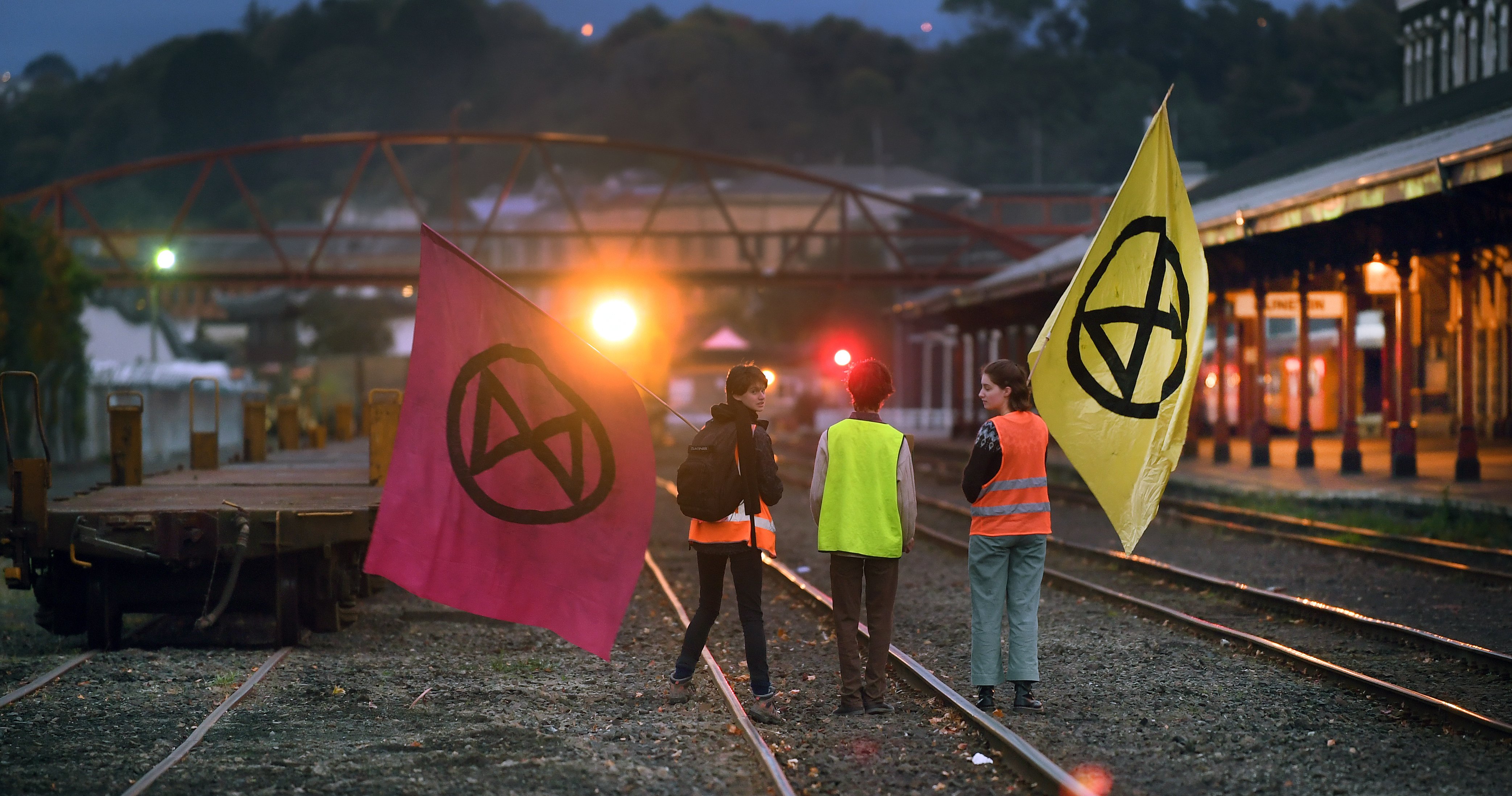 School pupils face off with a train transporting coal at the Dunedin Railway Station yesterday....