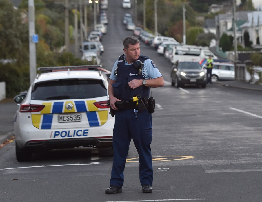Police in North Dunedin following an alleged theft from a commercial premises. Photo: Peter McIntosh