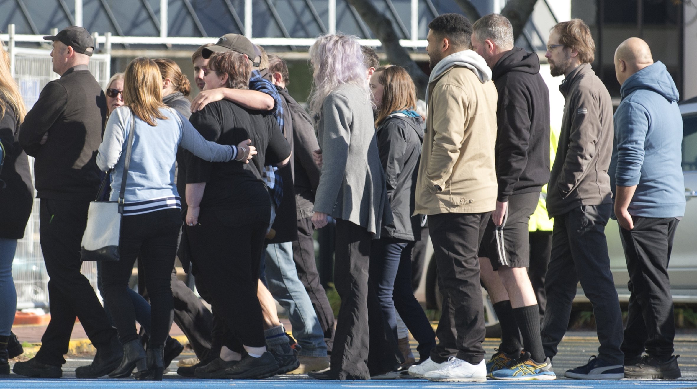 Countdown staff comfort each other as they enter the supermarket for yesterday’s blessing. PHOTO:...