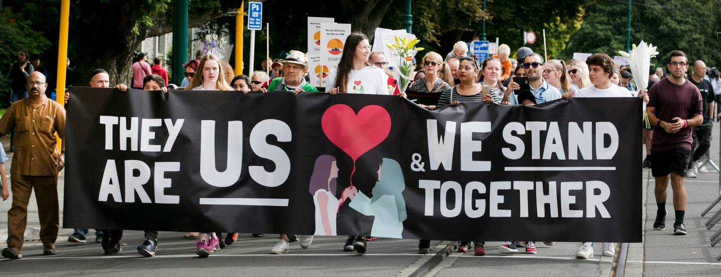 Marchers express support for the Muslim community after the Christchurch terror attacks. Photo:...