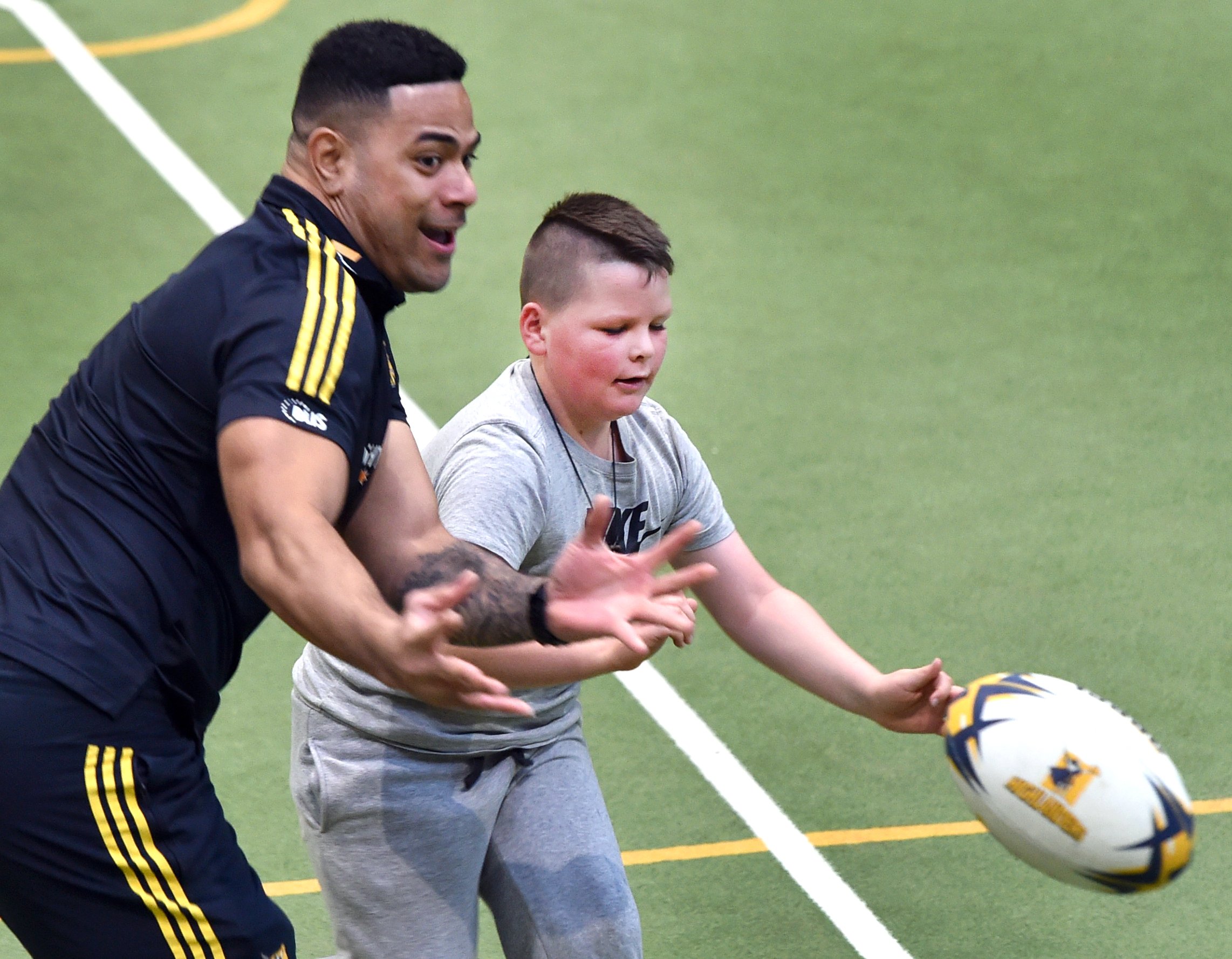  Injured Highlanders centre Fetuli Paea plays a game of touch with Noah Stevenson (9) at the...
