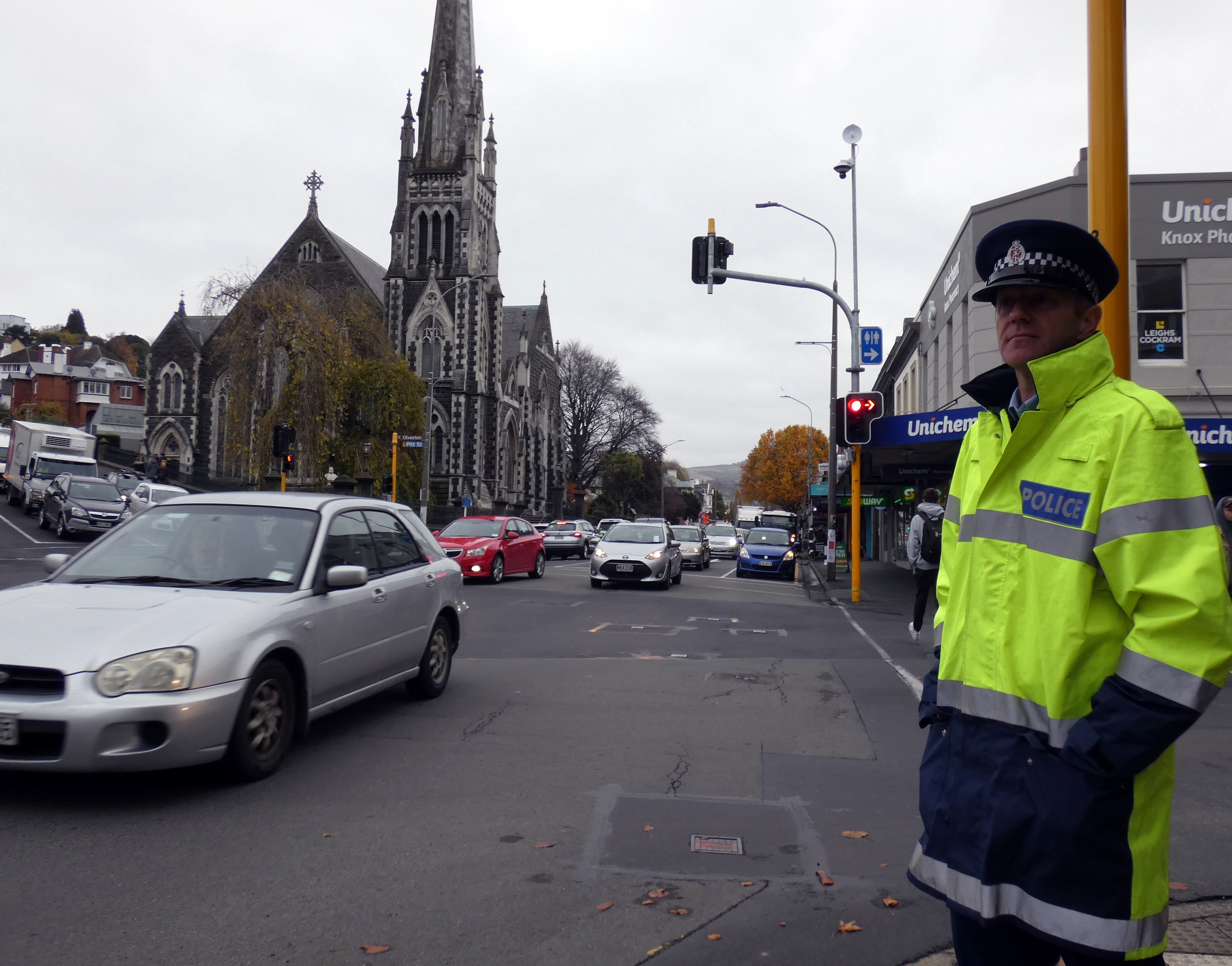 Senior Sergeant Craig Dinnissen, of Dunedin, observes vehicles at the intersection of George and...