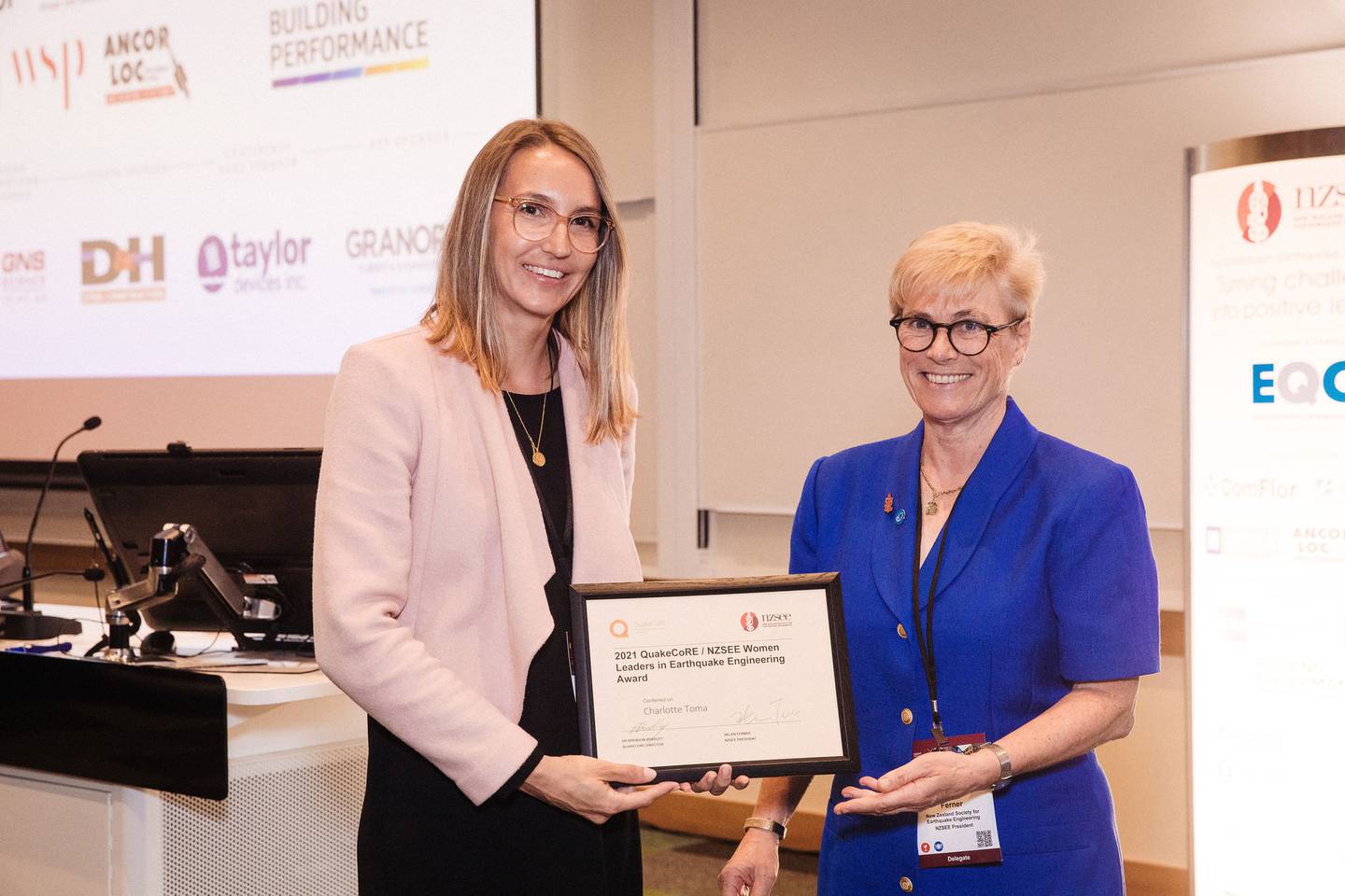 Society for Earthquake Engineering president Helen Ferner (right) presenting a women's leader...