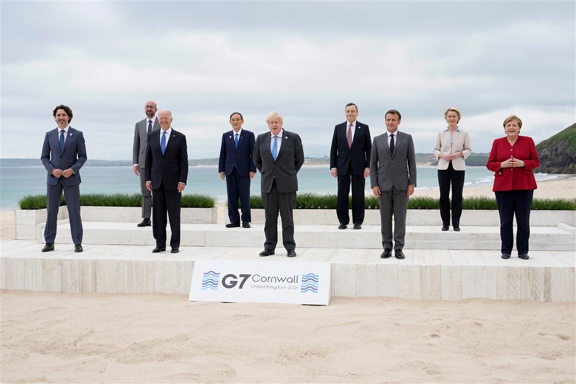 Posing for a group photo at the G7 summit are (L-R) Canadian Prime Minister Justin Trudeau,...