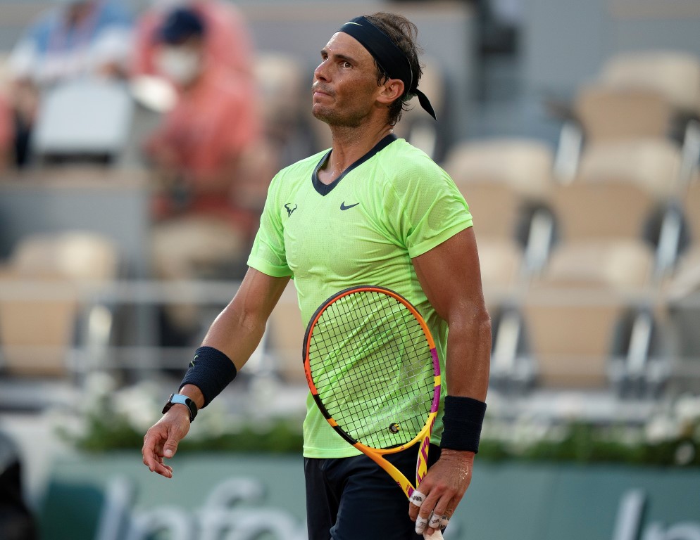 Rafael Nadal reacts against Novak Djokovic during their French Open semifinal match this year....