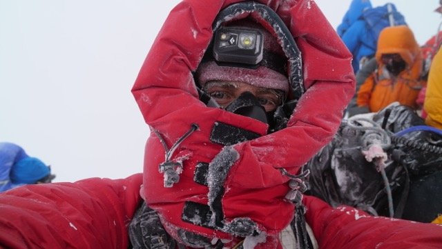 Wanaka documentary maker Scott Simper on the summit of Mt Everest in 2017. Mr Simper caught Covid...