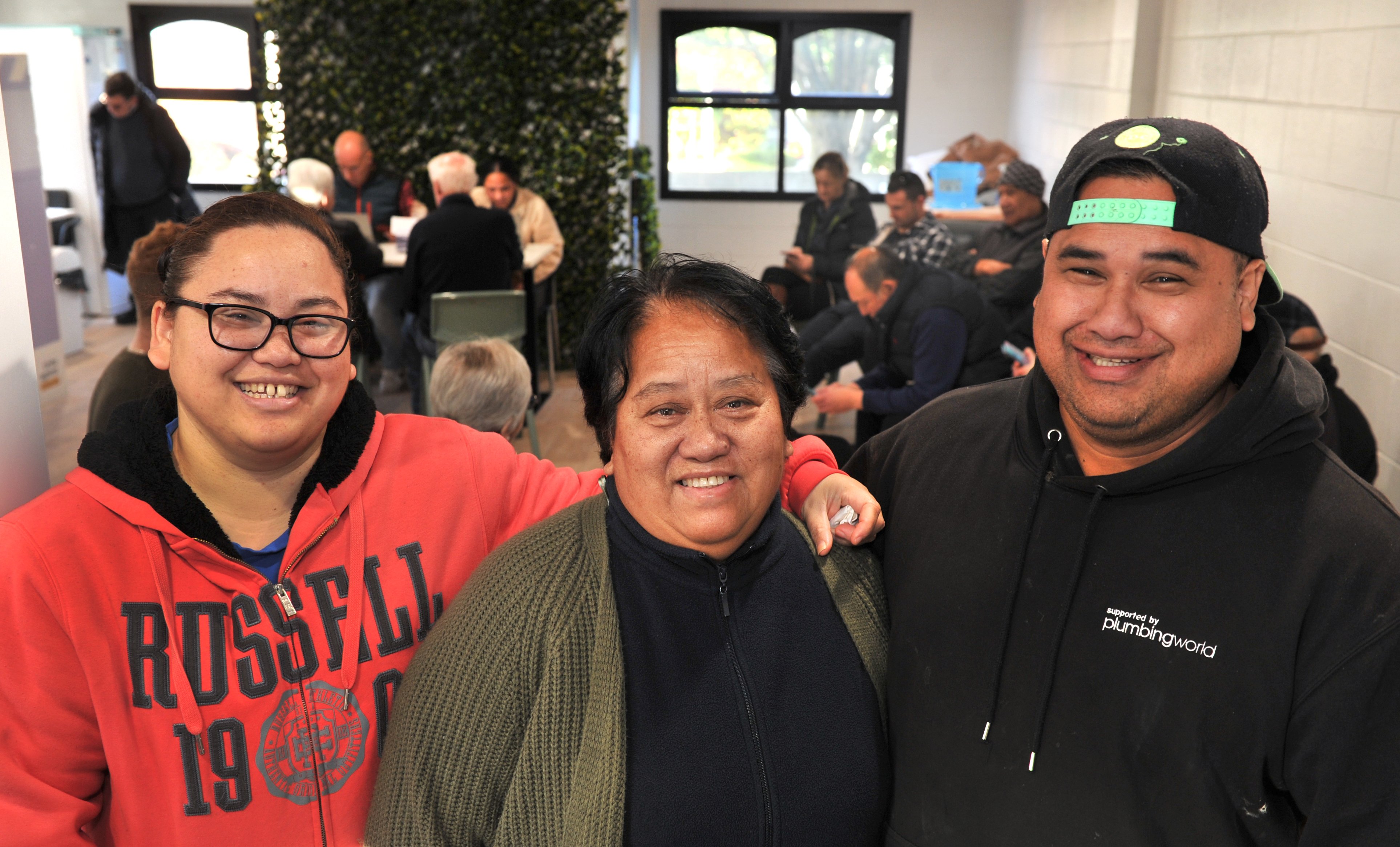The Vahua family, siblings Grace and Io and mother Tuakana Vahua, are all smiles as they receive...