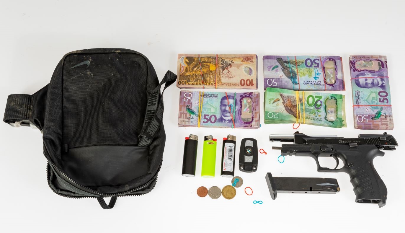 A firearm and about $42,000 in cash has been seized. Photo: supplied 