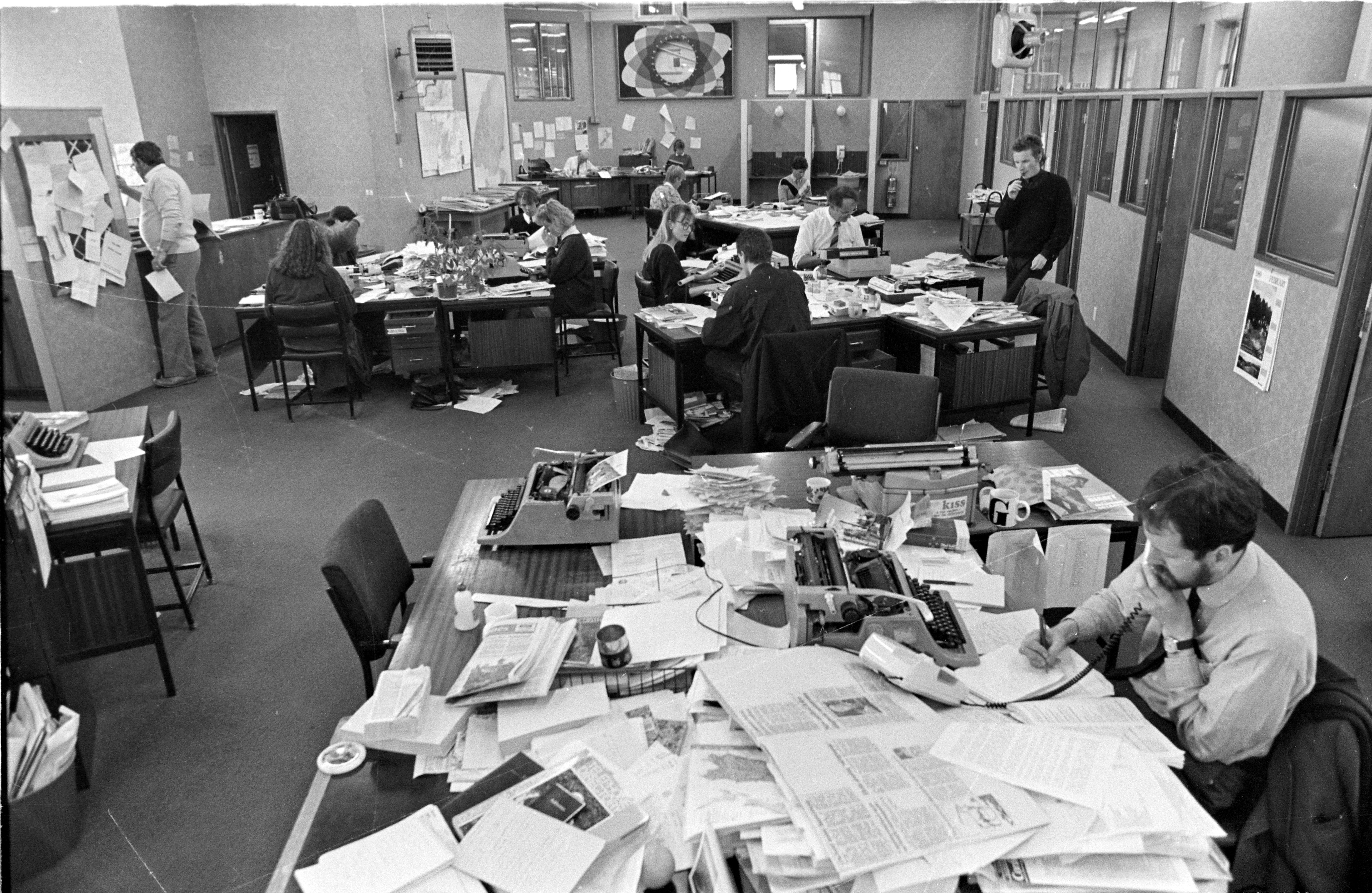 John Gibb conducts an interview  in the foreground of this photograph of the 
...