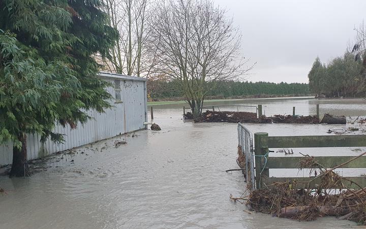 The exterior of the Williams family property remains submerged in floodwater. Photo: Supplied /...