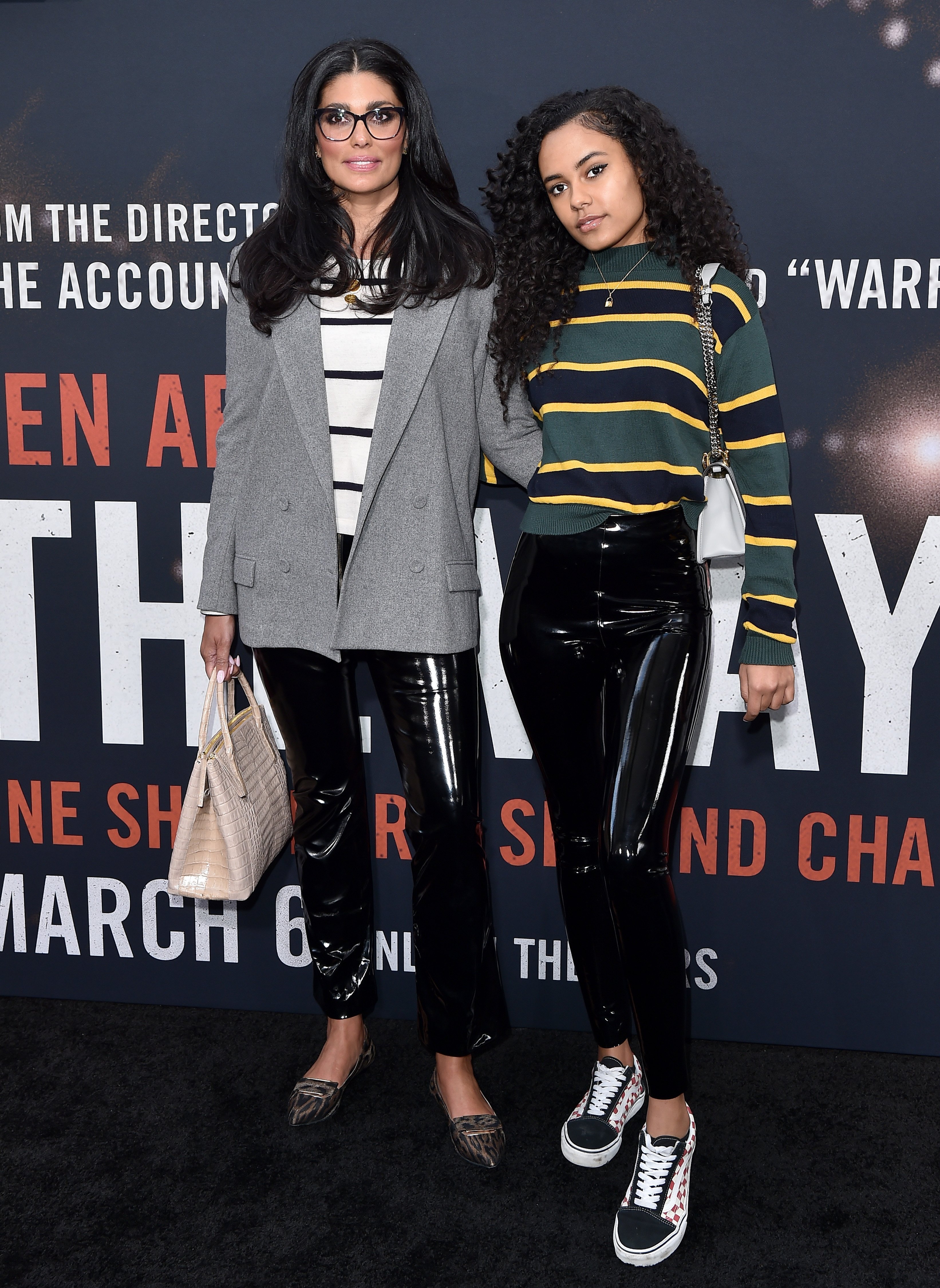 United States fashion designer Rachel Roy (left) and model Ava Dash wear Breton tops to a film...