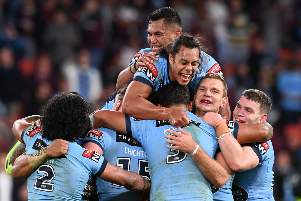 New South Wales players celebrate their victory over Queensland. Photo: Getty Images
