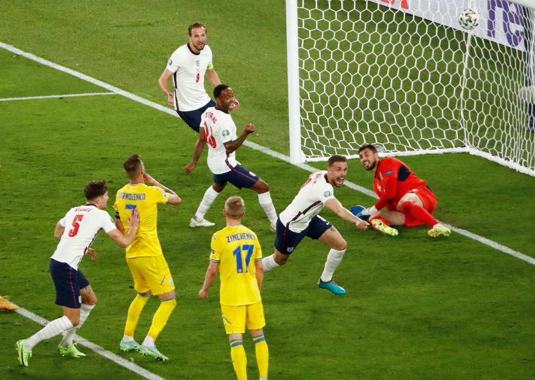 England's Jordan Henderson celebrates scoring their fourth goal against Ukraine. Photo: Pool via...