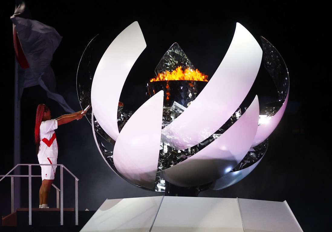 Naomi Osaka lights the Olympic cauldron at the opening ceremony. Photo: Reuters