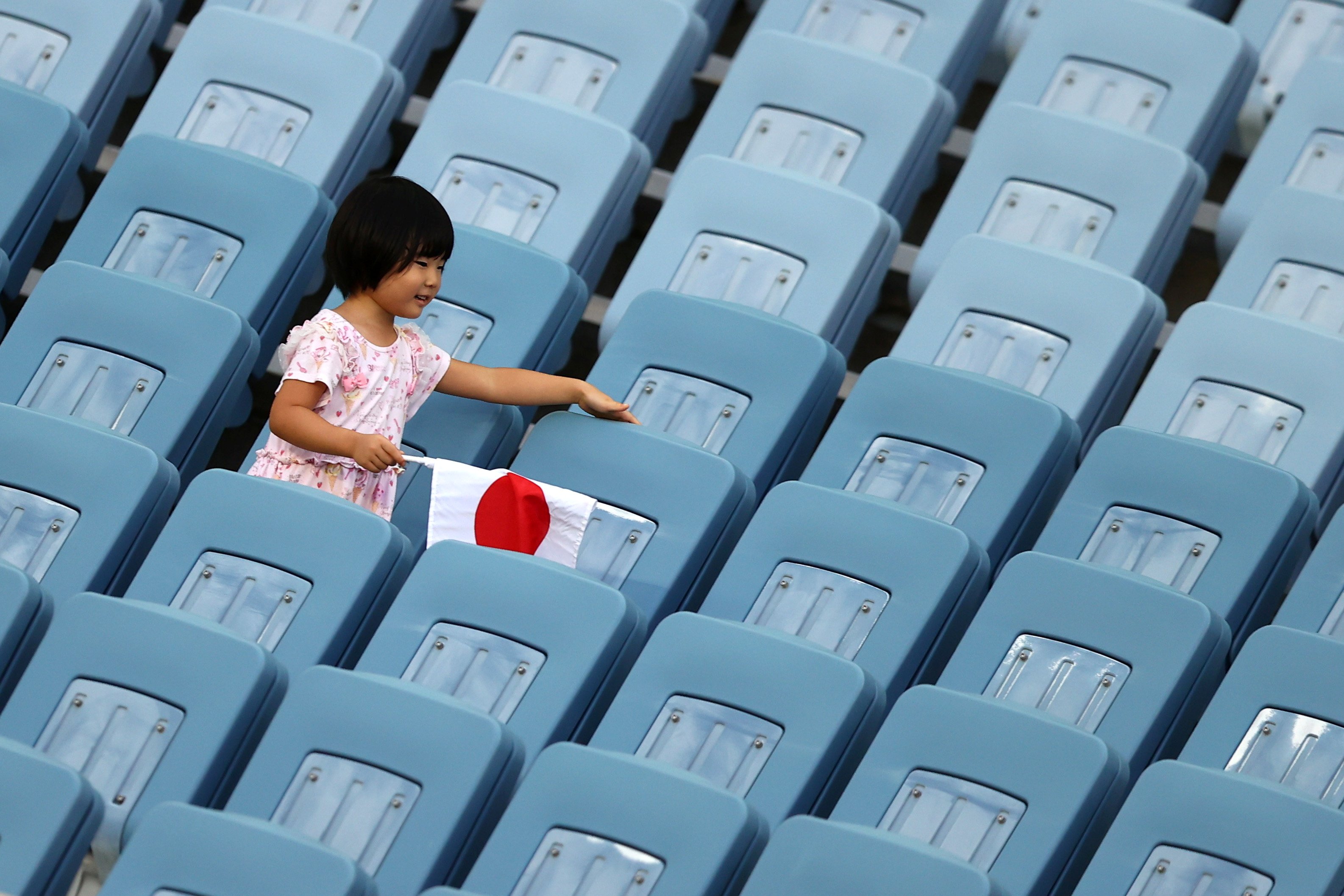 A young girl watches the women’s football pool match between the Football Ferns and Sweden this...