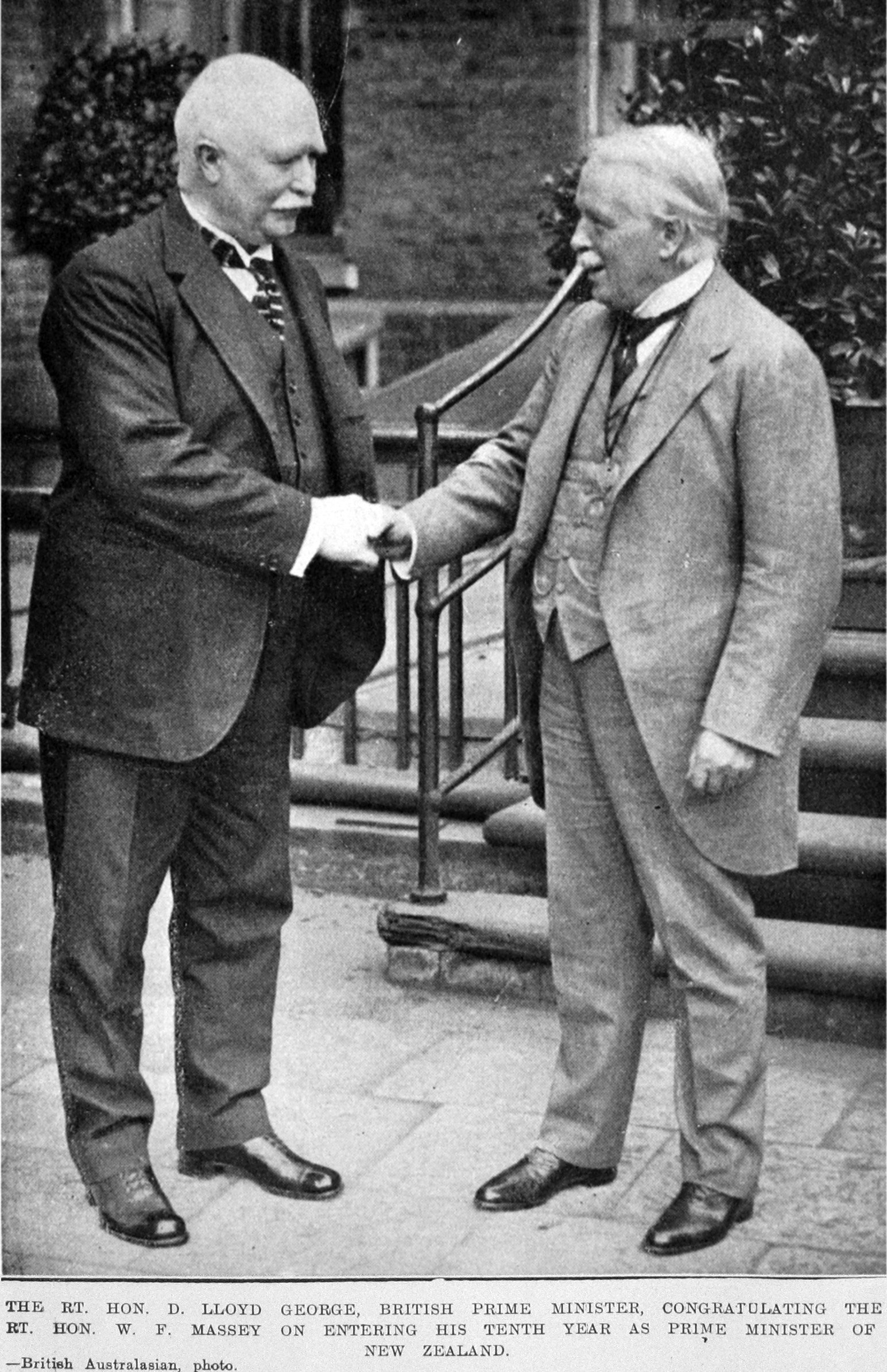 British Prime Minister Rt Hon David Lloyd George (right) congratulates Rt Hon William Massey. —...