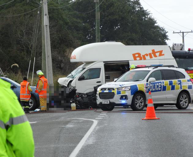 Emergency services at the scene of a fatal vehicle accident where a motorcyclist was killed at...