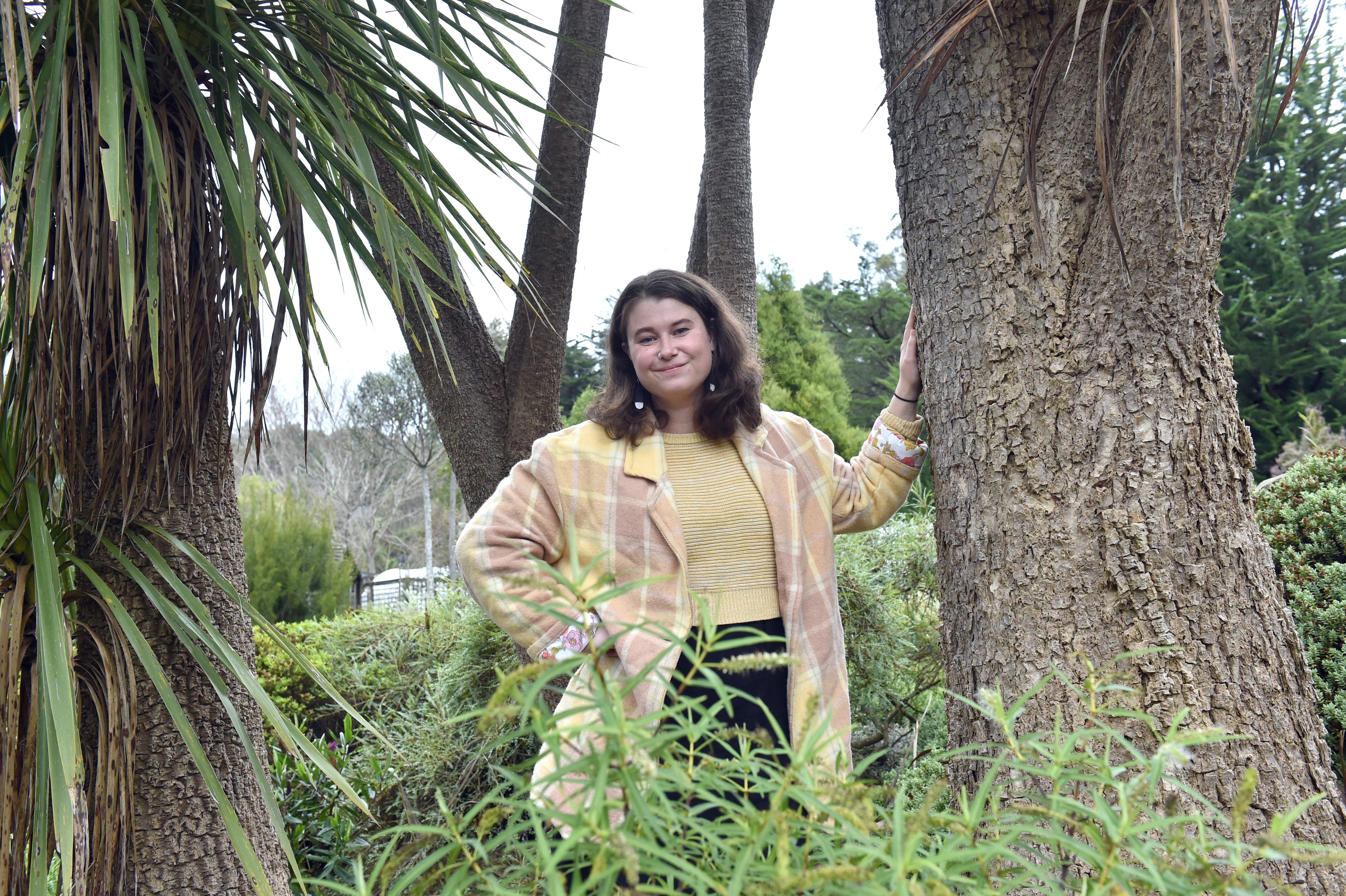 Forest fascination . . . Science communication masters student Olivia Taylor-Peebles, examining...