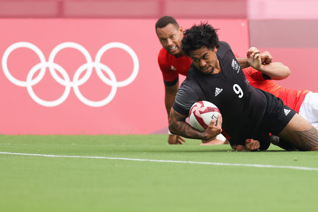 Regan Ware is tackled short of the try line during the Rugby Sevens Men's Semi-final match between New Zealand and Great Britain. Photo: Getty Images