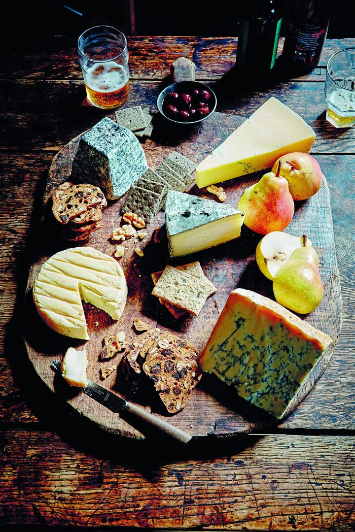 Place cheeses on a serving board with a separate knife for each, and a varied selection of...